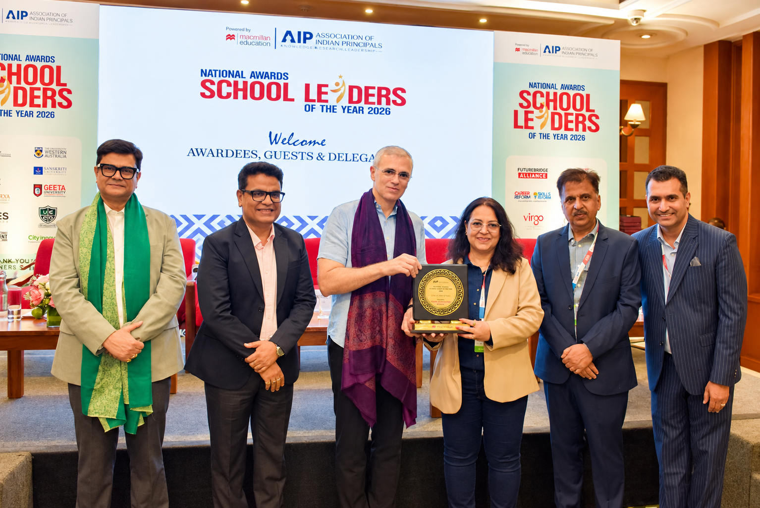 Dr. Chetna Sabharwal with fellow education leaders and her award